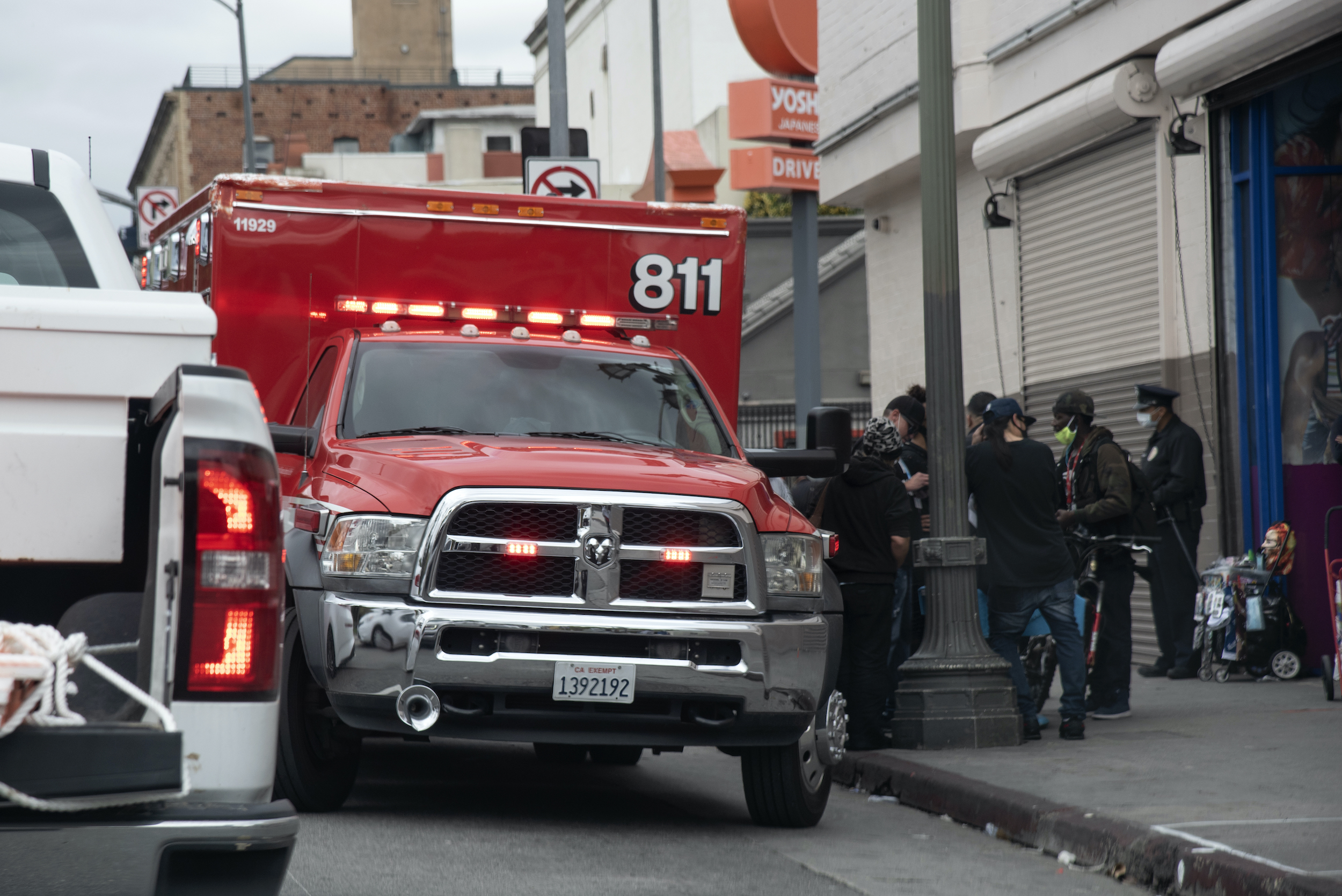 Los Angeles, CA/USA - April 9, 2020: Paramedics assist a homeless person on the streets during the coronavirus outbreak