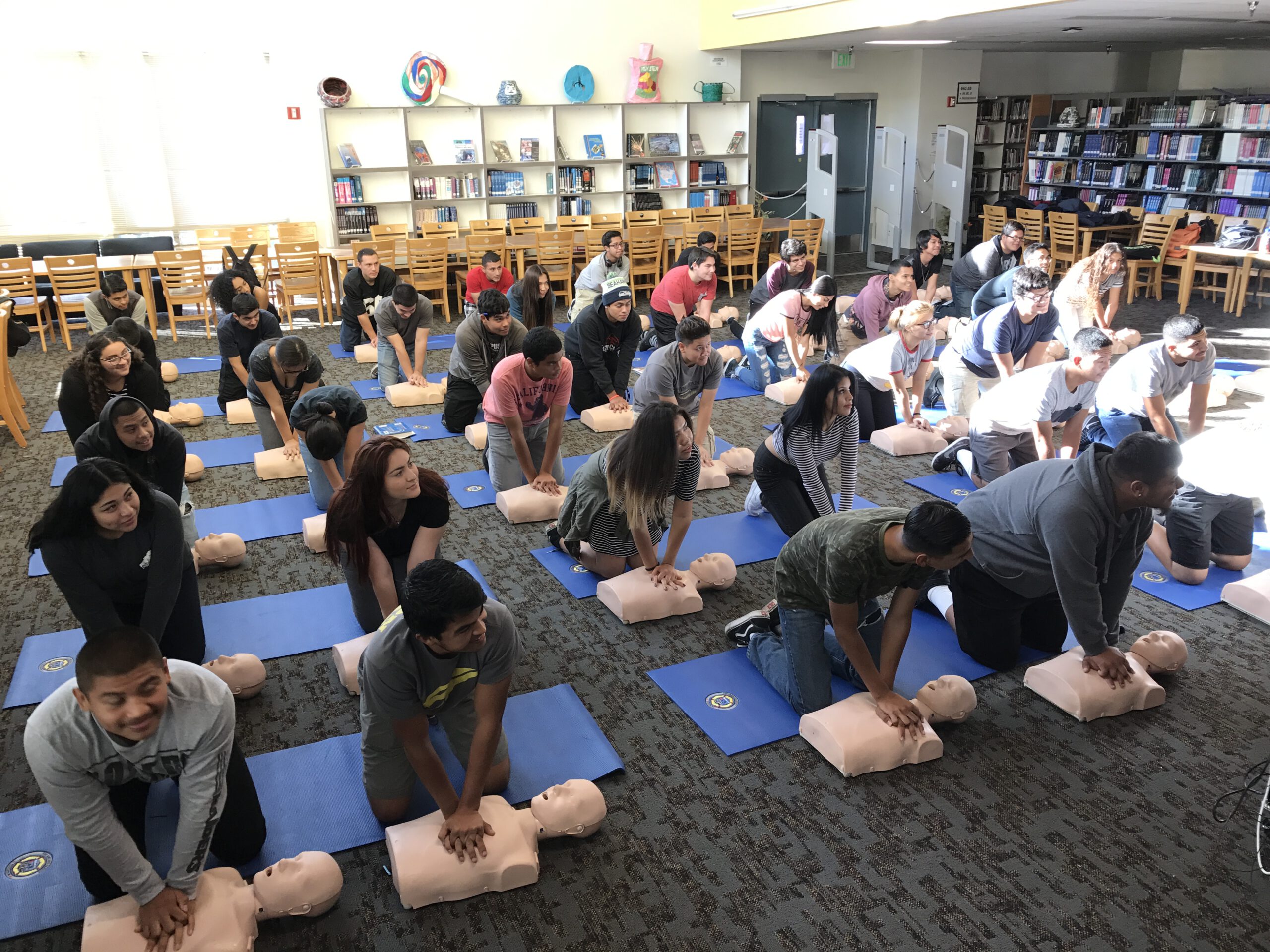 High school students performing CPR exercises